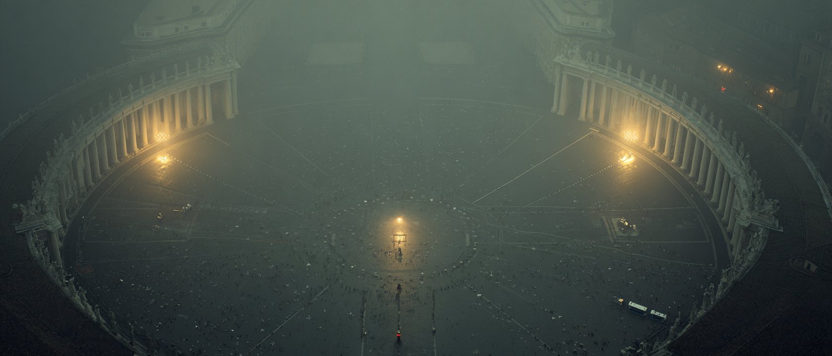 St. Peter's Square from above at grey dawn, lamps still burning